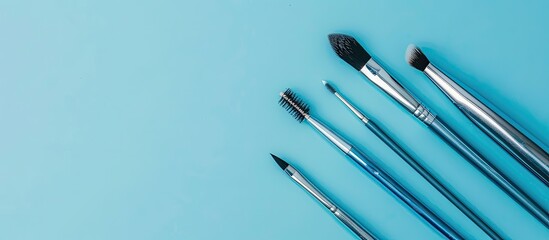 Poster - Professional eyebrow tools on a blue background in a flat lay composition with room for text in the image. Copy space image. Place for adding text and design