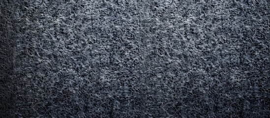Poster - Abstract art background with a dark gray felt texture, showcasing a solid color material with a grainy surface, and an ample copy space image.