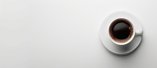 Wall Mural - Isolated on a white background, the coffee cup and saucer create a simple yet elegant composition with copy space image.