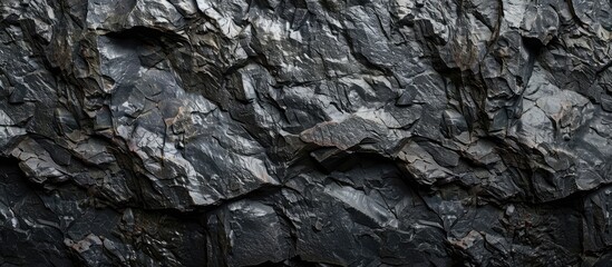 Poster - Dark rock texture on a black grunge background, suitable for a copy space image.
