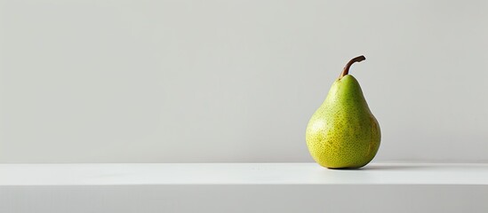 Wall Mural - A solitary green pear on a blank white backdrop with ample copy space image.