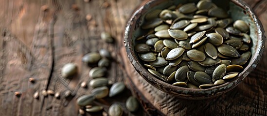 Poster - Close-up of pumpkin seeds presented in vintage dishes on a wooden backdrop, with ample copy space image available.
