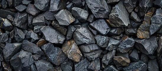 Poster - Background of black textured rocks with ample copy space image.