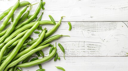 Wall Mural - Green beans arranged on white wooden table with space for text