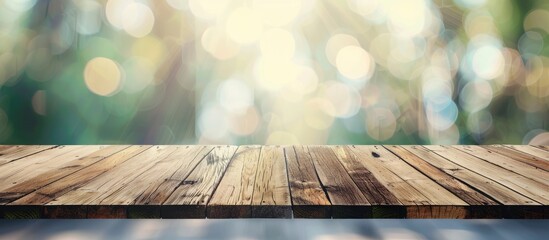 Aufkleber - An empty wooden table surface with a blurred abstract backdrop provides ample copy space for text on a marketing promotion image.