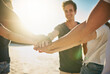 © Stratford/peopleimages.com - Beach, stack and group with hands together, holiday or travel with support, team building and vacation. Friends, seaside and men with women, ocean and cooperation with getaway trip, break or closeup