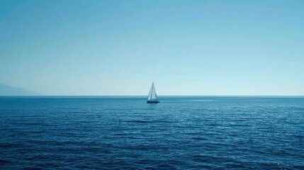 Wall Mural - Deep blue sea with a lone sailboat in the distance, emphasizing the vastness and solitude of the ocean
