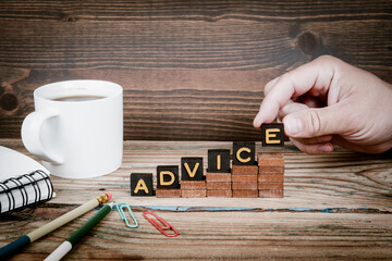 Wall Mural - ADVICE. Old letter tiles on wooden steps, development concept