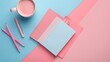 © Thanaporn - A pink and blue notebook sits on a blue and pink background