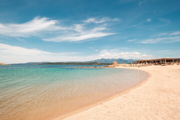 Wall Mural - Turquoise Mediterranean sea and beach bar at the Plage de Tonnara on the south west coast of the island of Corsica