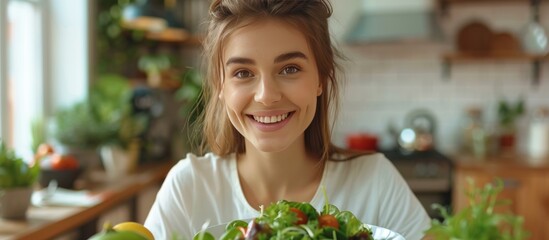 Wall Mural - Smiling Woman Holding a Bowl of Salad