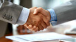 © Ivan - Handshake to seal business and deals between two entities. Concept: agreement.
