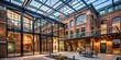 © Adisorn - Modern glass atrium addition seamlessly blends with restored historic brick facade in renovated 19th century industrial building, showcasing adaptive reuse and preservation.