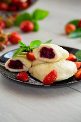 Wall Mural - cooked sweet homemade steamed dumplings with strawberries