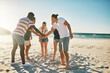 © Stratford/peopleimages.com - Beach, stack and group with hands together, summer and travel with support, team building and nature. Friends, seaside and men with women, ocean and cooperation with holiday, getaway trip or vacation