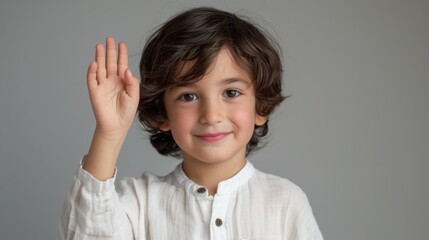 Wall Mural - The smiling boy waving hello