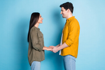 Aufkleber - Profile photo of two nice young partners hold arms wear shirt isolated on blue color background