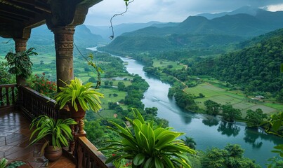 Sticker - A panoramic view of a winding river through a lush valley, seen from a balcony of a highland retreat