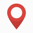 © Hogr - A red location pin icon, commonly used in maps and navigation applications. The pin is designed with a triangular shape pointing downwards, and it has a circular hole in the top center.