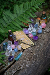 Poster - set of colorful minerals and oracle cards in forest, natural background. Gemstones for Magic Crystal Ritual. Witchcraft, spiritual esoteric practice. litho therapy. divination tarot reading
