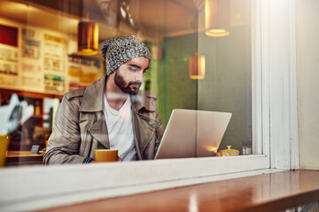 Poster - Man, distance learning and laptop in cafe by window with studying, internet search and online course. Coffee shop, restaurant and computer for typing and university elearning website with student