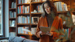 © Jirawatfoto - Professional woman with a tablet in a modern library environment