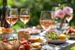 © SKIMP Art - A group of glasses filled with rose wine, surrounded by plates full of food and snacks on an outdoor wooden table Generative AI