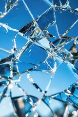 Poster - A shattered glass window with a clear blue sky visible through the cracks, suitable for use in crime or accident scene photography