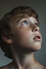 Poster - A close-up shot of a young boy with bright blue eyes, suitable for use in a variety of contexts including editorial, commercial, and personal projects