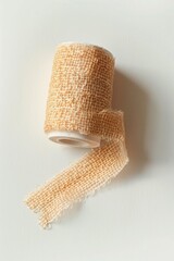 Poster - A single roll of Burlock tape placed on a white surface, perfect for close-up shots or product photography
