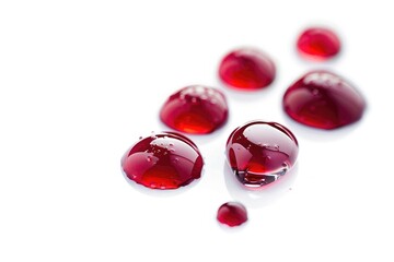 Poster - Close-up of small red water droplets sitting on a white surface, possibly indicating recent rainfall or condensation