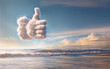 © Artsem Martysiuk - Clouds forming a thumbs up shape over the ocean, symbolizing positive vibes and approval