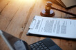 © Sutthicha - Judge gavel with Justice lawyers having team meeting at law firm background. Concepts of Law and Legal services.