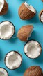 © iVGraphic - Halved coconuts on blue background, top view. Tropical fruit and summer concept