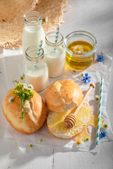 Wall Mural - Homemade and sweet wheat buns served with milk.