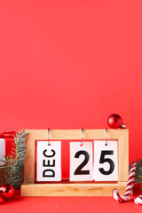 Wall Mural - Decorations and calendar with date of Christmas on red background