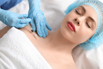 Poster - Beautiful young woman receiving filler injection in beauty salon