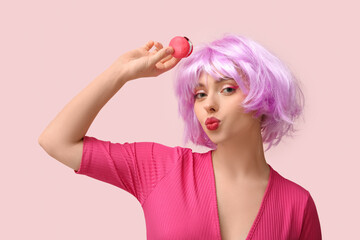 Sticker - Beautiful young woman in wig with sweet macaroon on pink background