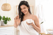 © Pixel-Shot - Beautiful young happy woman with jar of hair mask in bathroom at home
