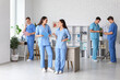 © Pixel-Shot - Group of young doctors working in clinic