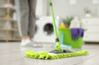 © Pixel-Shot - Janitor mopping floor in laundry room, closeup
