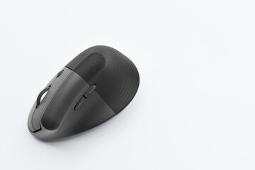 Black and gray wireless mouse with buttons and a tempered white background.