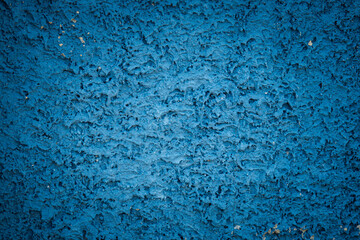 Wall Mural - A blue wall with a textured surface