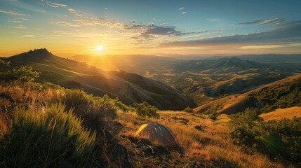 Wall Mural - A scenic campsite on a hilltop overlooking a sprawling valley bathed in the golden light of the setting sun.