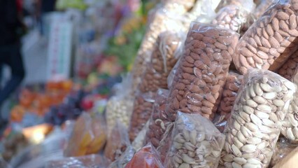 Poster - many mixed nuts in a plastic packet on shelf 