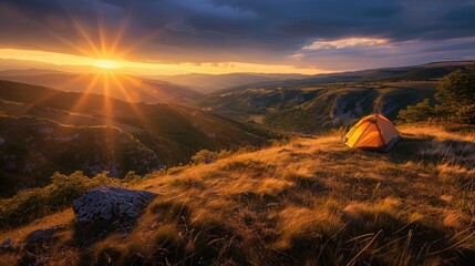 Wall Mural - A scenic campsite on a hilltop overlooking a sprawling valley bathed in the golden light of the setting sun.