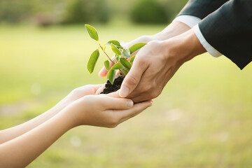 Sticker - Businessman handing plant or sprout to young boy as eco company committed to corporate social responsible, reduce CO2 emission and embrace ESG principle for sustainable future.Gyre