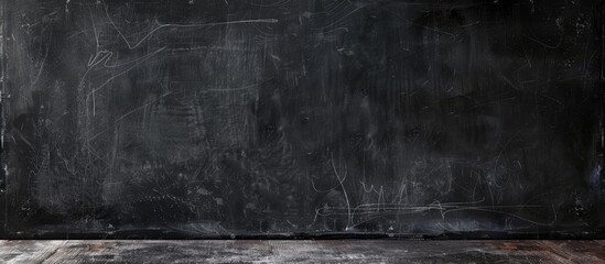 Aged black background featuring a worn texture, dark wall covering, blackboard, chalkboard, and concrete
