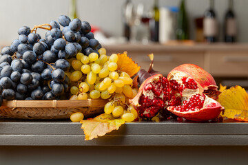 Wall Mural - Ripe juicy grapes and pomegranate.