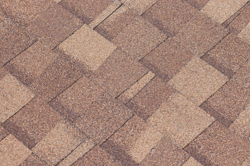 Canvas Print - A brown shingled roof with a tan and brown color. brown roof shingle background and texture.